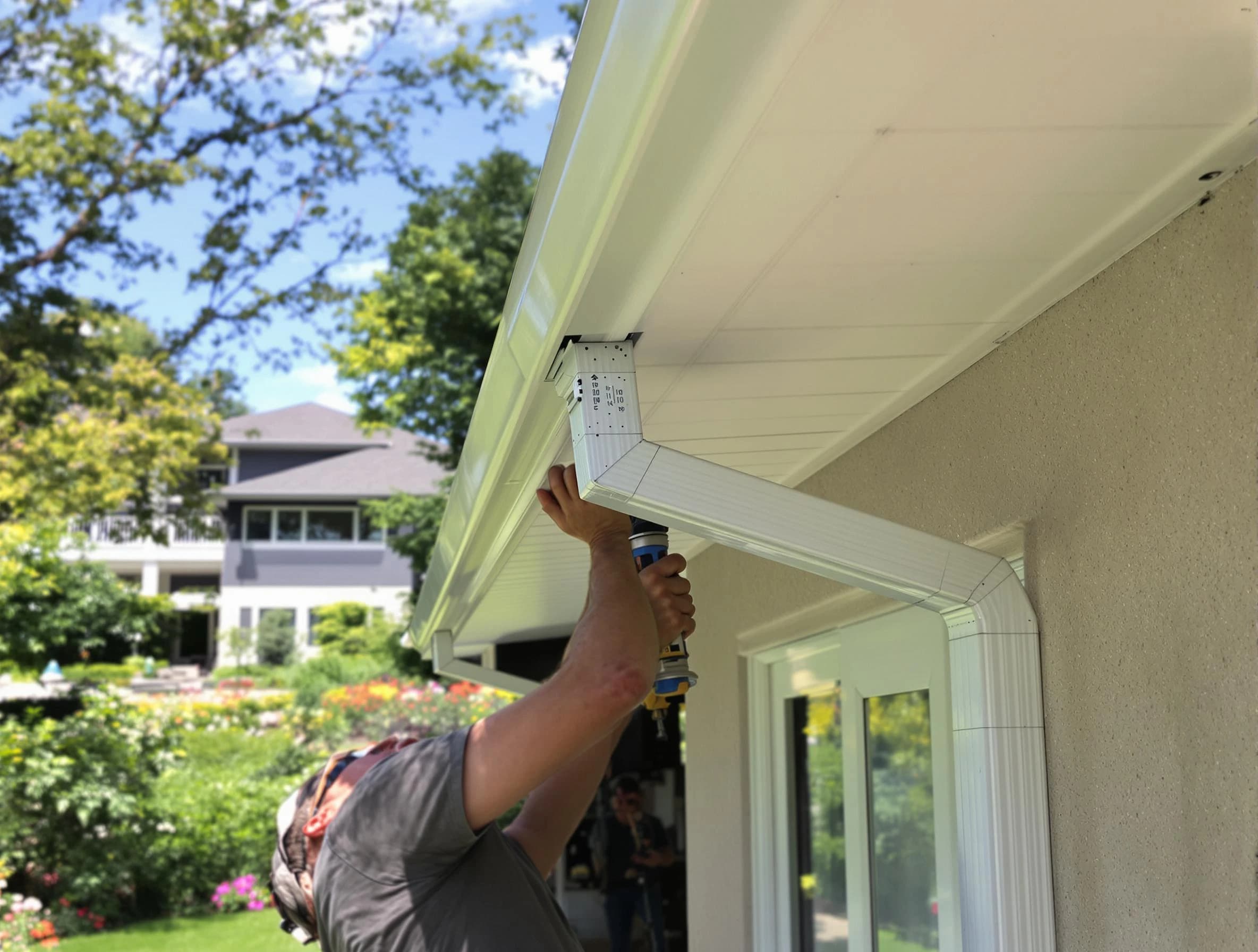 Elyria Roofing Company technicians performing gutter installation in Elyria, OH